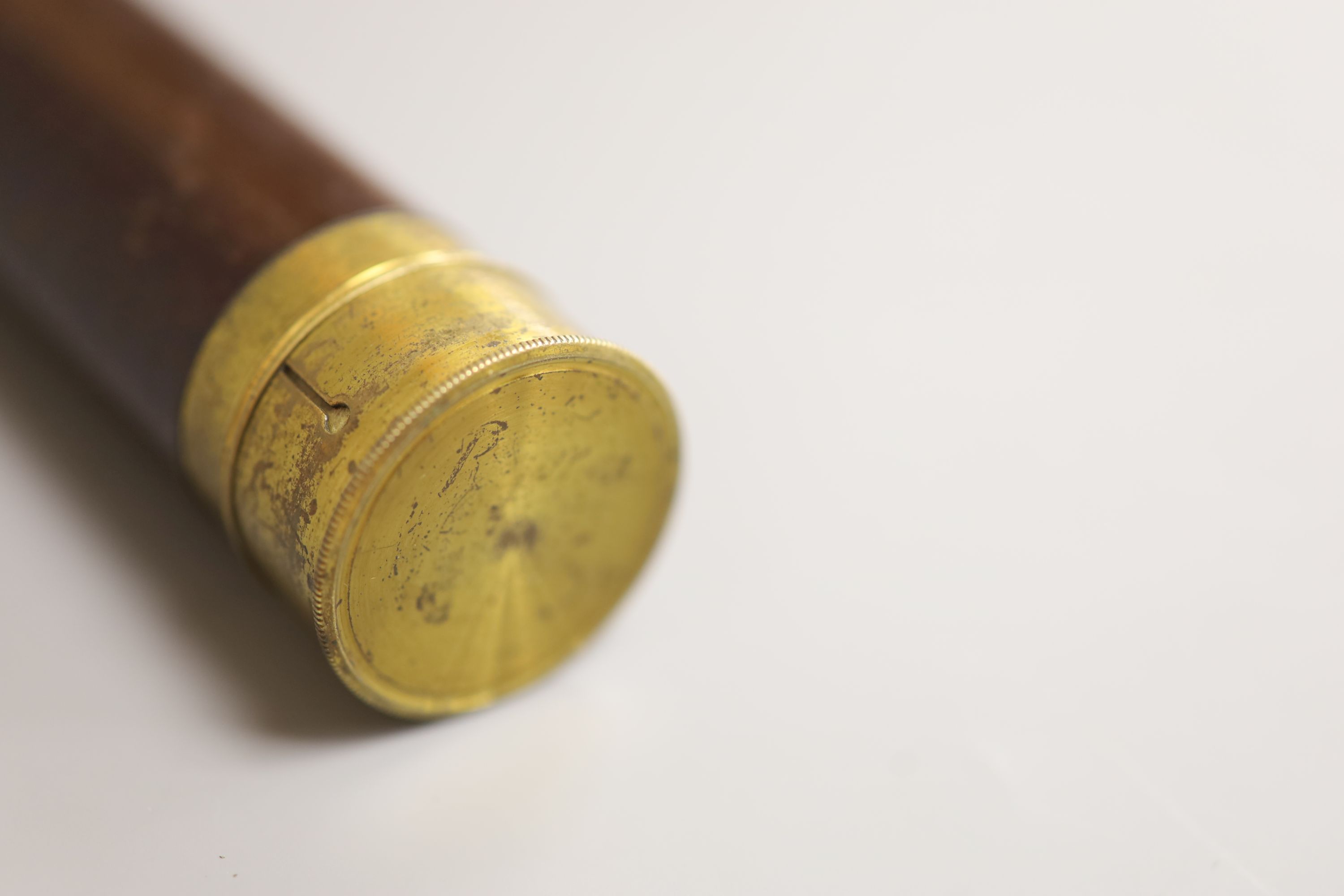 An early 20th century brass and mahogany three drawer telescope, overall length 40.5cm extended